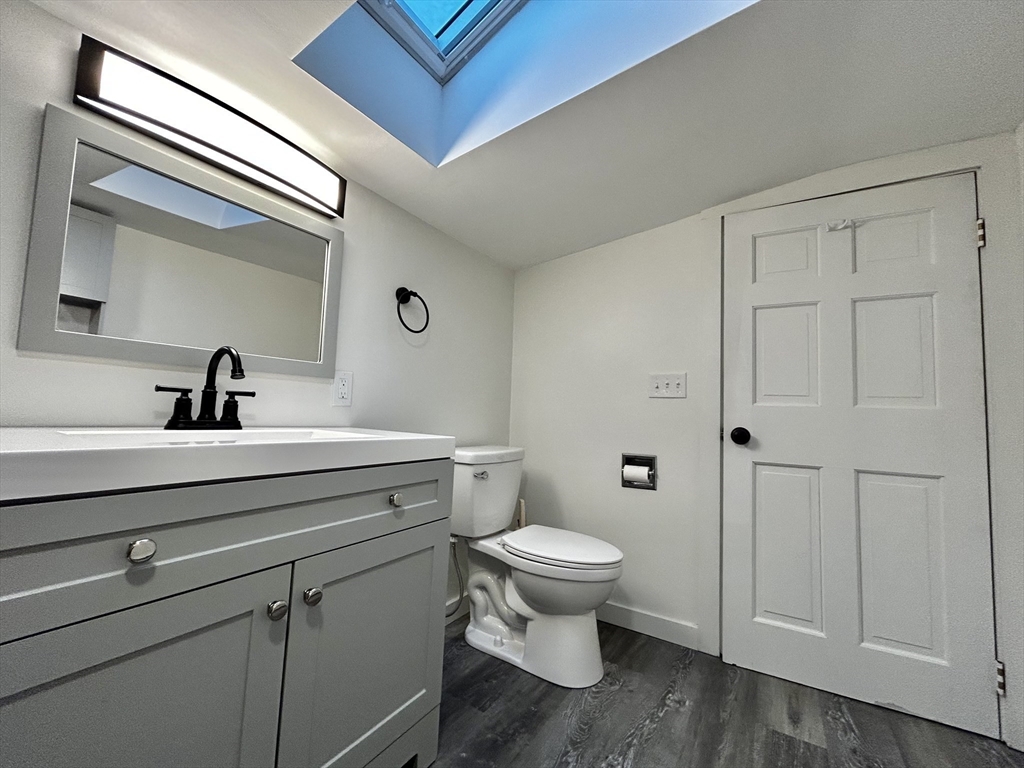 46 Elm Street, Unit 2 Buckland, MA 01370 - Photo 13 of 15 a bathroom with a sink a toilet and shower
