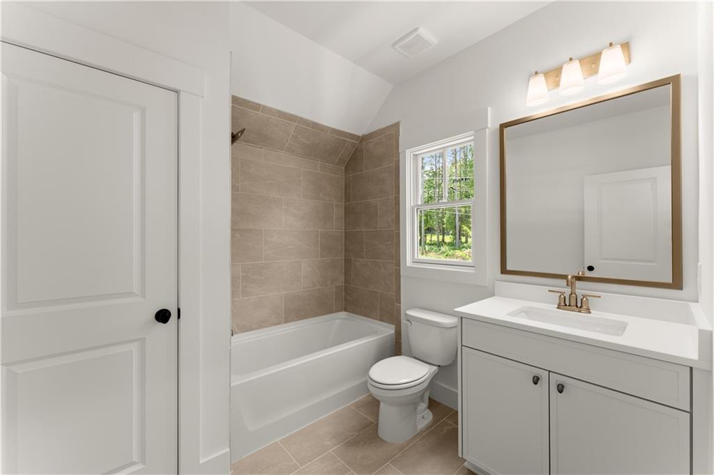 285 Reese Way Ball Ground, GA 30107 - Photo 29 of 30 a bathroom with a sink toilet and shower