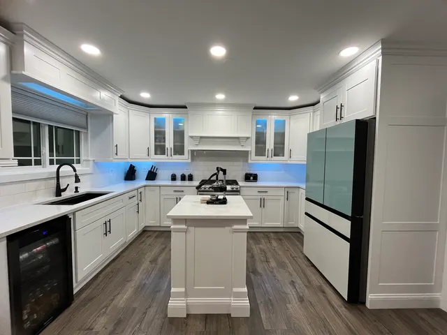 a kitchen with a sink stainless steel appliances and cabinets