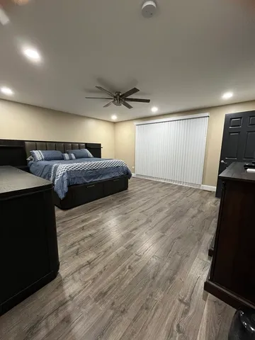 a view of a room with wooden floor