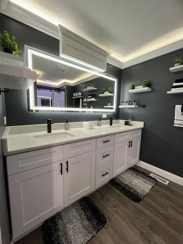a kitchen with a sink and cabinets