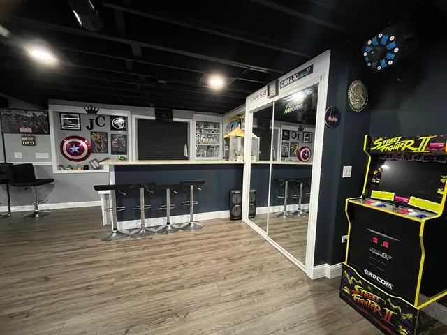 a living room with lots of furniture and kitchen view