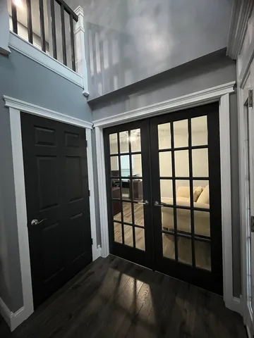 a view of empty room with windows