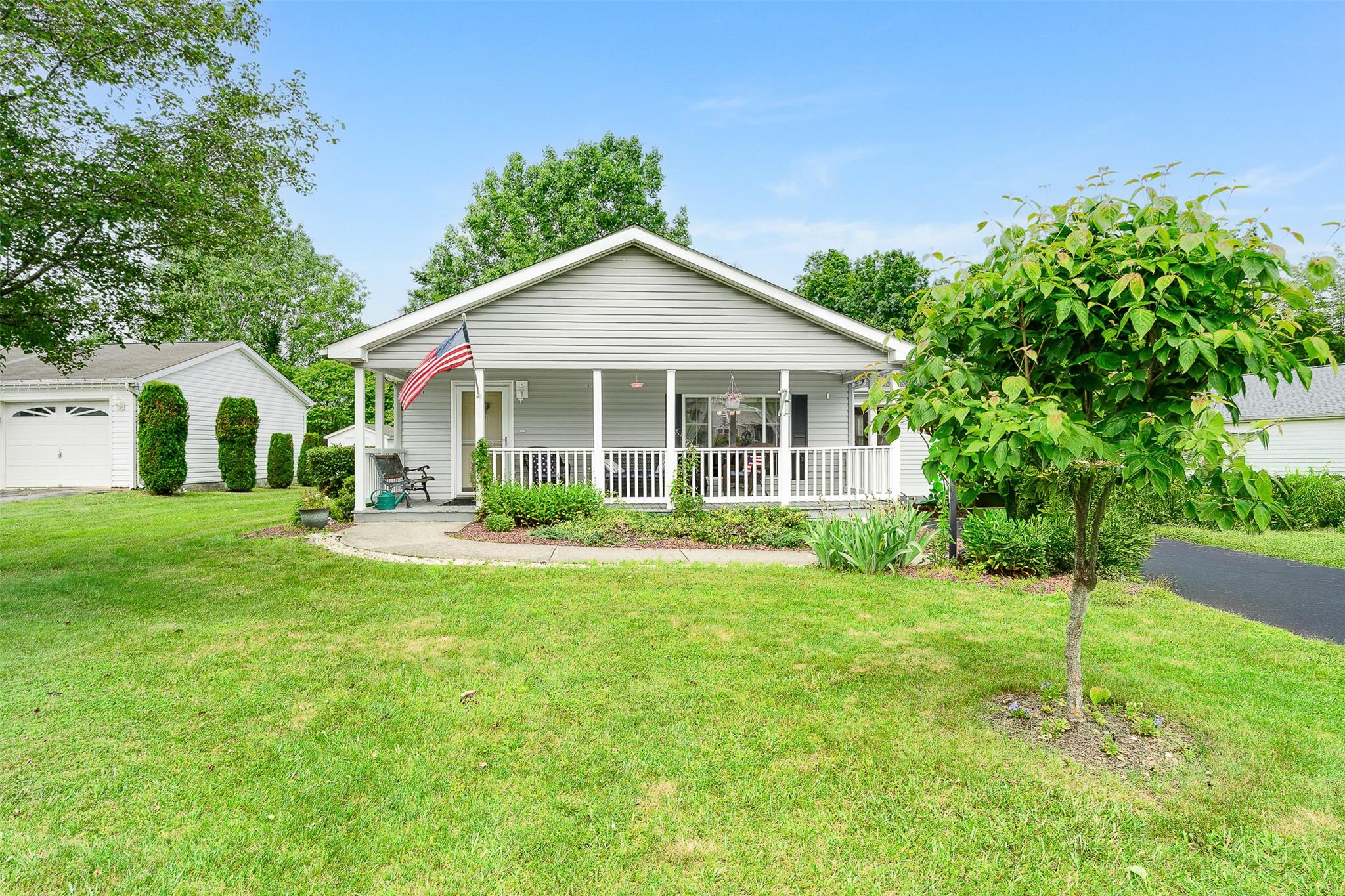 21 Biscayne Boulevard Poughkeepsie, NY 12603 - Photo 1 of 1 View of front of house with a porch, a front lawn, and a garage