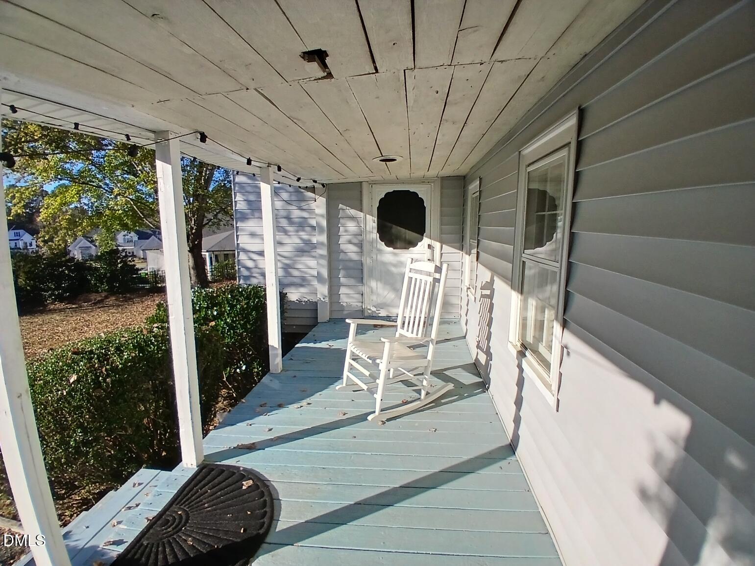 1920 Kelly Road Apex, NC 27502 - Photo 43 of 44 a view of a porch with chairs and backyard