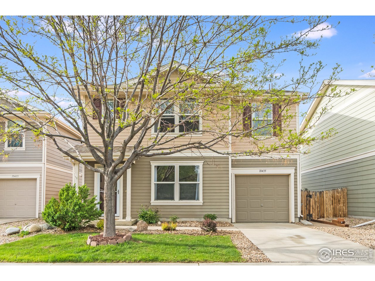 10435 Lower Ridge Road Longmont, CO 80504 - Photo 1 of 26 a front view of a house with garden