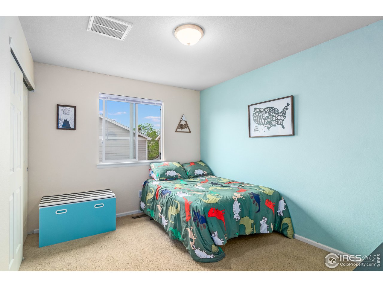 10435 Lower Ridge Road Longmont, CO 80504 - Photo 15 of 26 a bedroom with a bed and a window