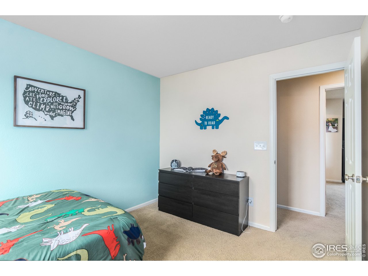 10435 Lower Ridge Road Longmont, CO 80504 - Photo 16 of 26 a bed sitting in a bedroom next to a window