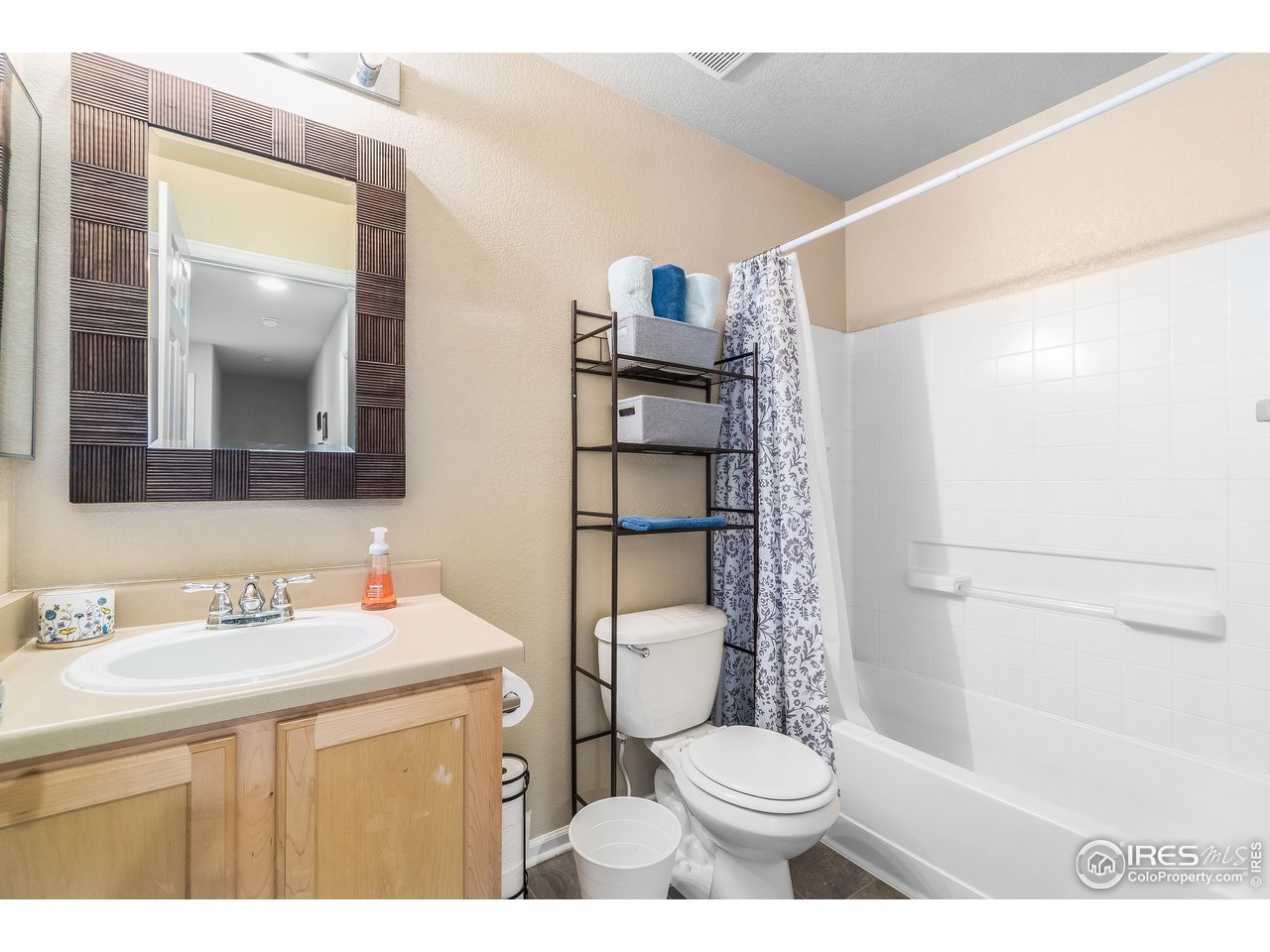 10435 Lower Ridge Road Longmont, CO 80504 - Photo 17 of 26 a bathroom with a sink toilet and shower