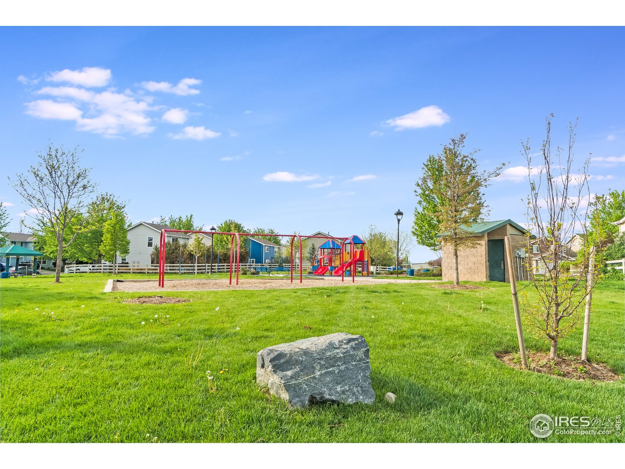 10435 Lower Ridge Road Longmont, CO 80504 - Photo 25 of 26 a backyard of a house with table and chairs