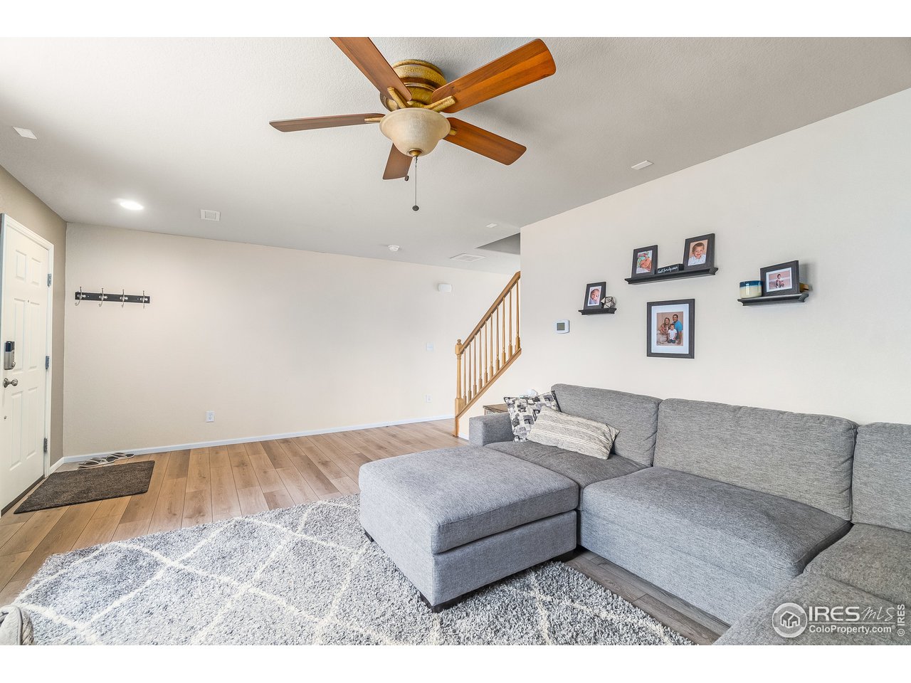 10435 Lower Ridge Road Longmont, CO 80504 - Photo 3 of 26 a living room with furniture and a ceiling fan
