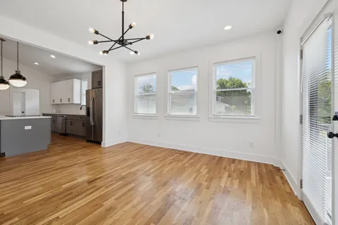 a bathroom with a double vanity sink and mirror