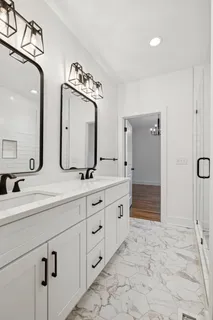 a bedroom with a bed and flat screen tv