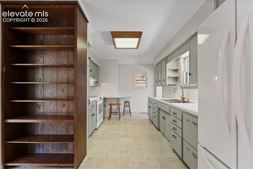 7755 Topeka Avenue Cascade, CO 80809 - Photo 9 of 38 Extra shelving between kitchen and dining