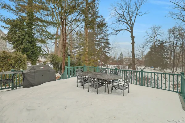 a view of a patio with a table and chairs