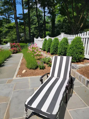 a view of a backyard with sitting area