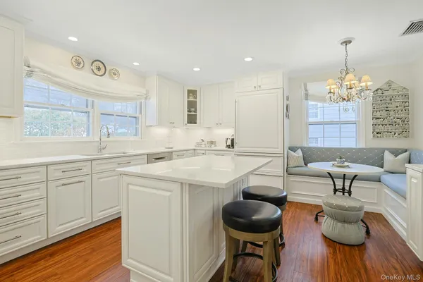 a kitchen with stainless steel appliances granite countertop a sink and cabinets