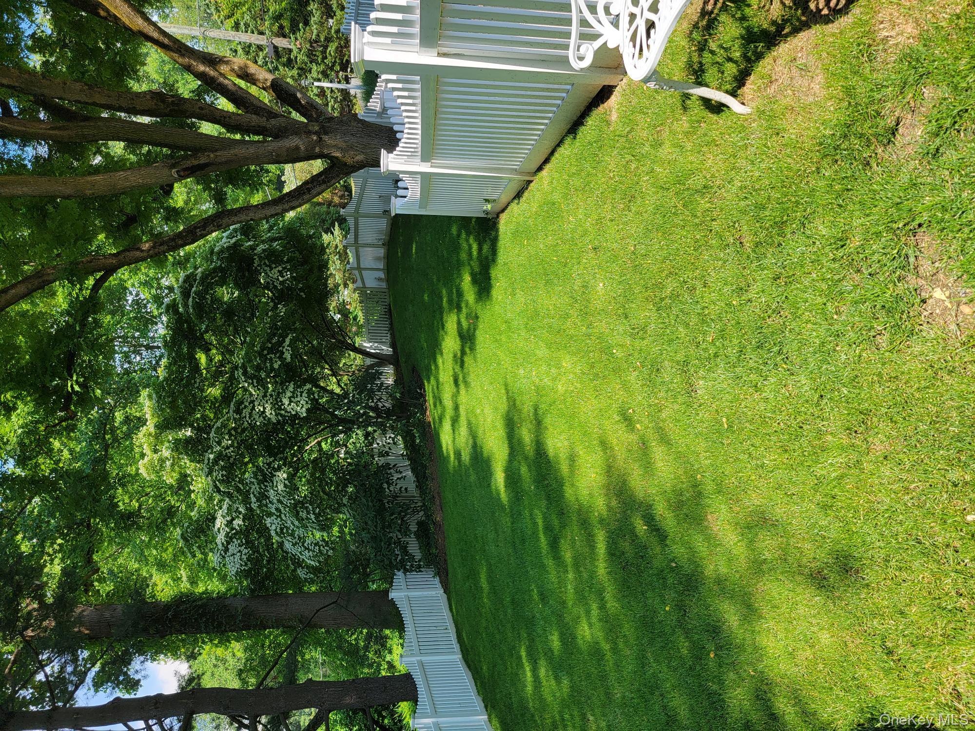 103 River Road Briarcliff Manor, NY 10510 - Photo 31 of 37 a view of a garden with a tree