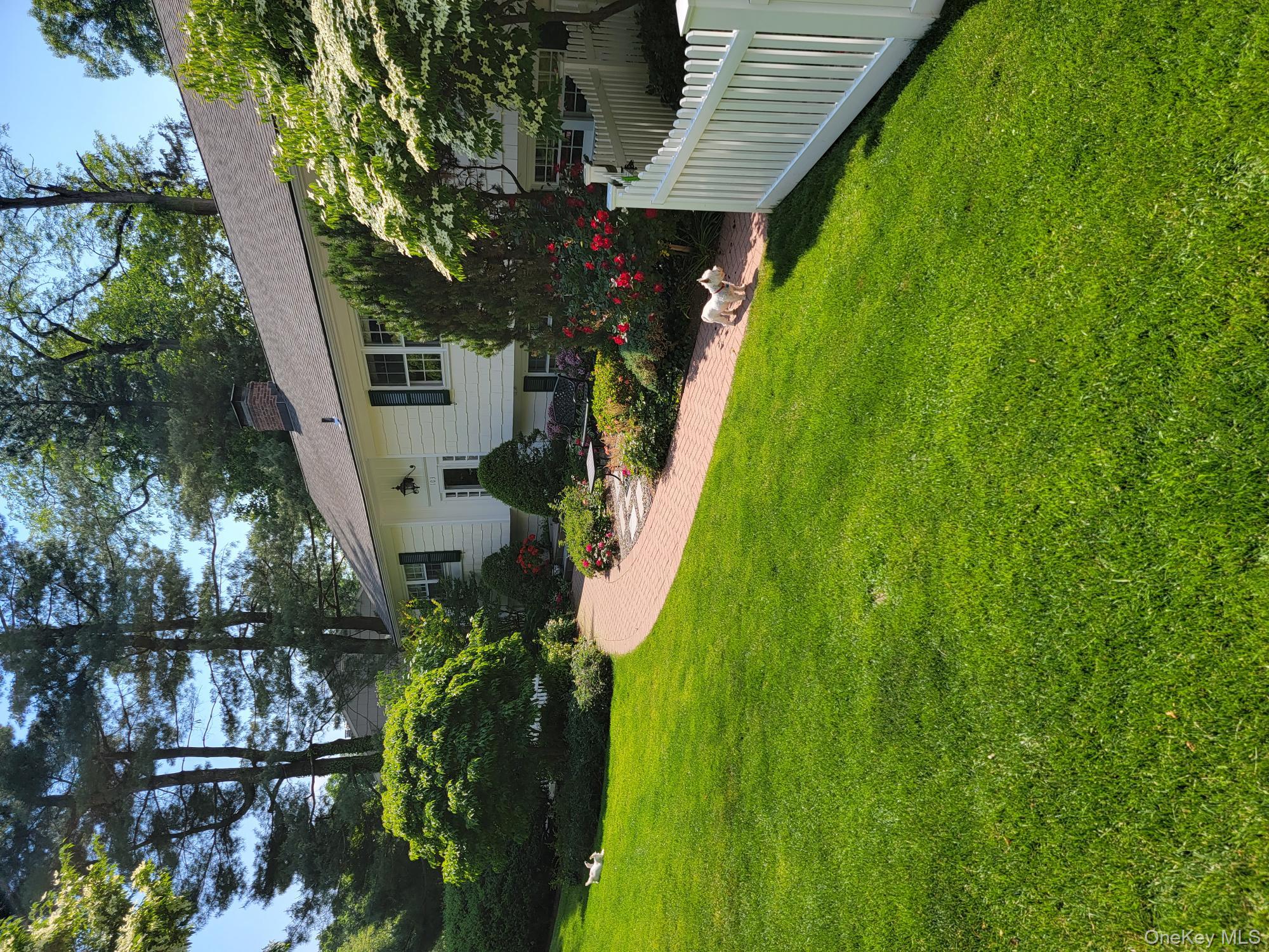 103 River Road Briarcliff Manor, NY 10510 - Photo 36 of 37 a view of a house with backyard and garden
