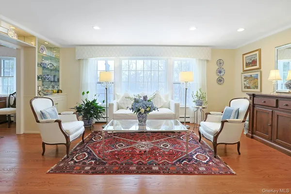 a living room with furniture rug and window