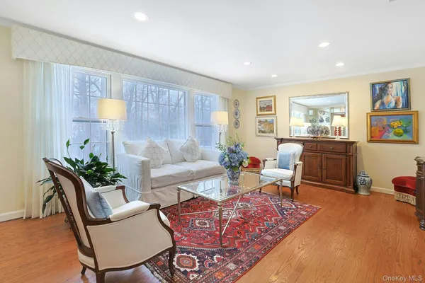a living room with furniture and a lamp