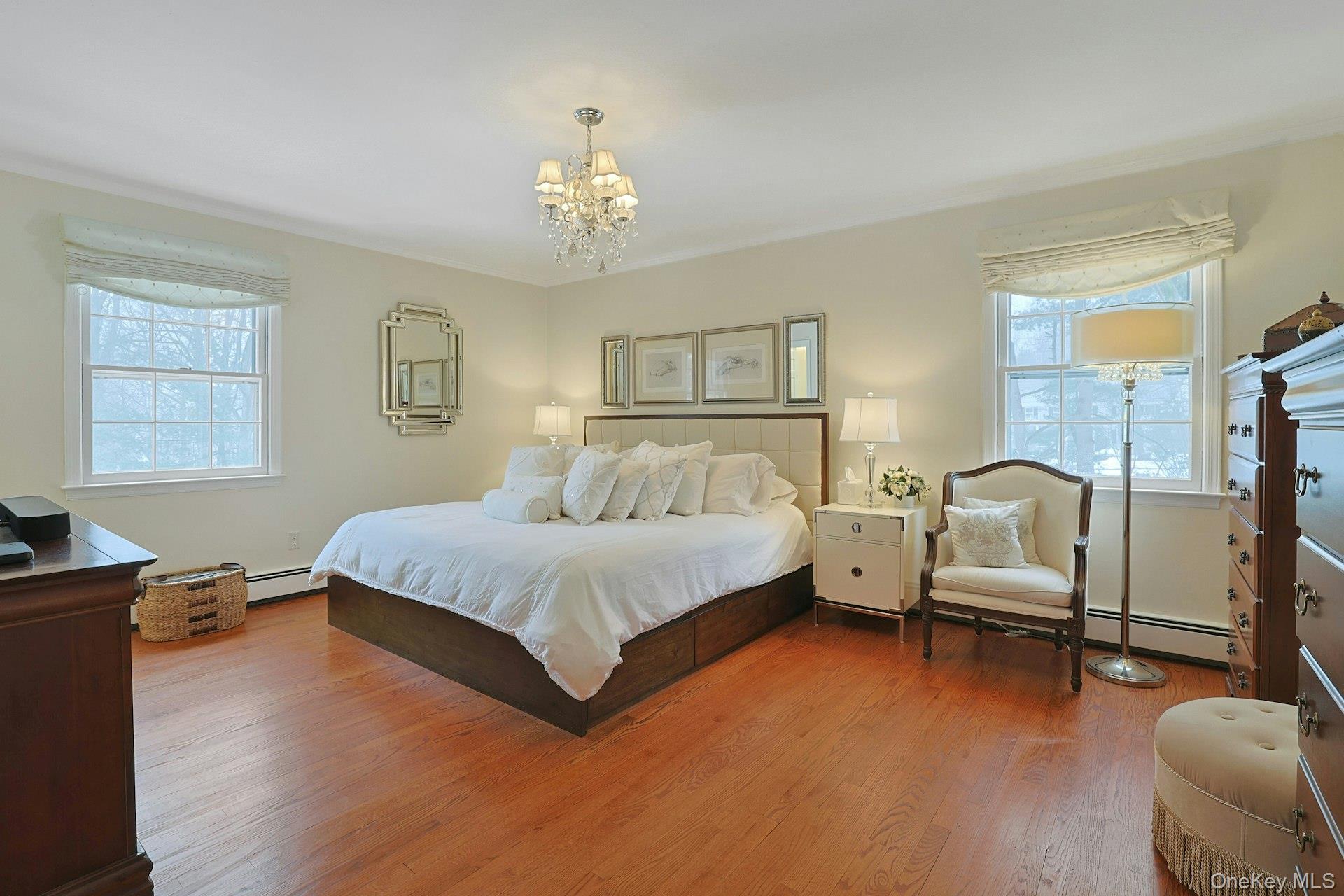 103 River Road Briarcliff Manor, NY 10510 - Photo 9 of 37 a spacious bedroom with a bed and wooden floor