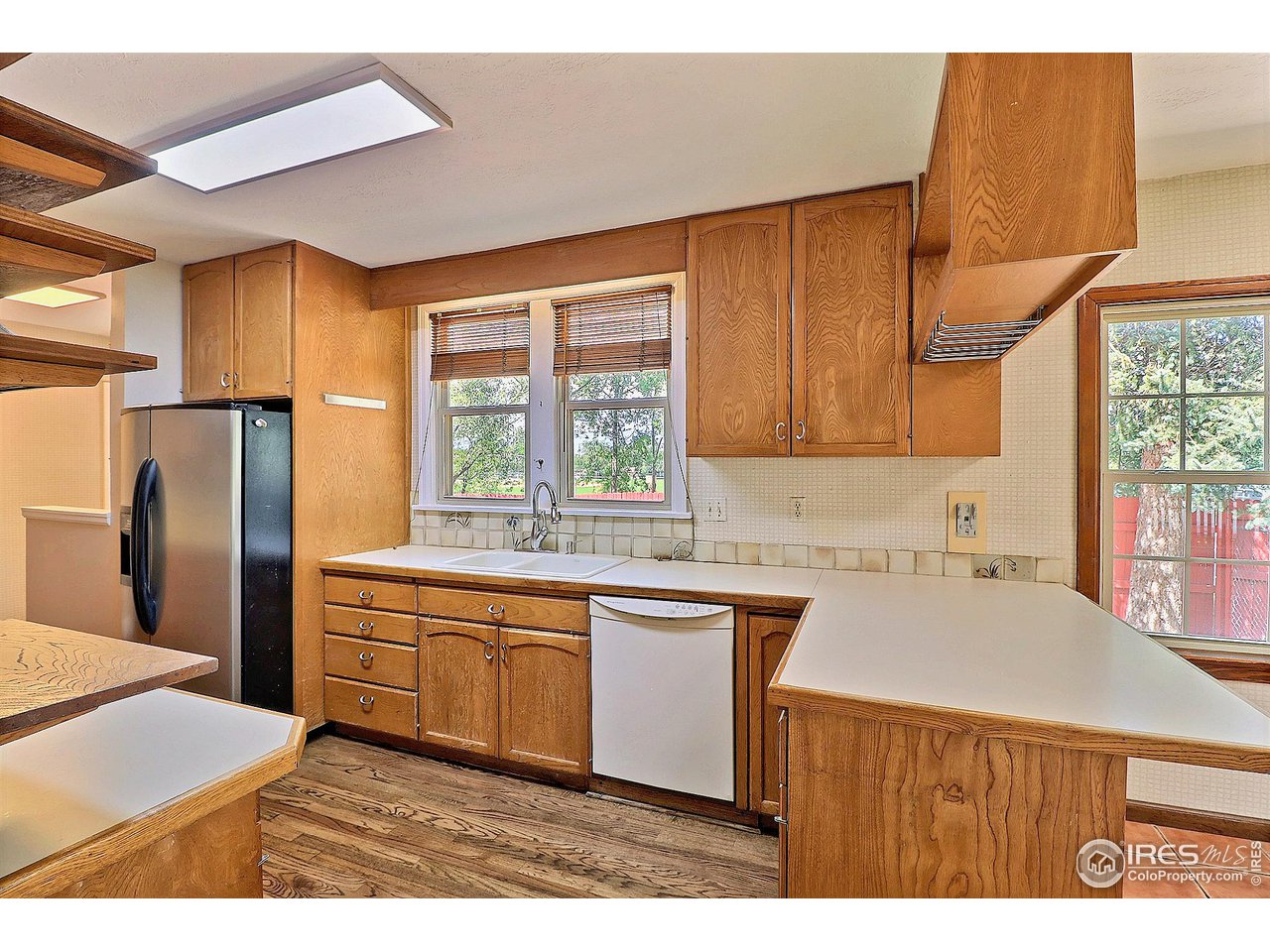 1607 Fairacre Drive Greeley, CO 80631 - Photo 12 of 40 a kitchen with stainless steel appliances granite countertop a sink a stove and refrigerator