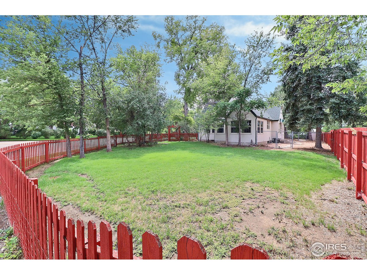 1607 Fairacre Drive Greeley, CO 80631 - Photo 39 of 40 a view of a backyard with a garden
