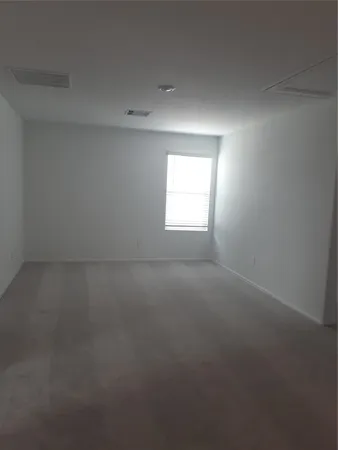an empty room that has a window