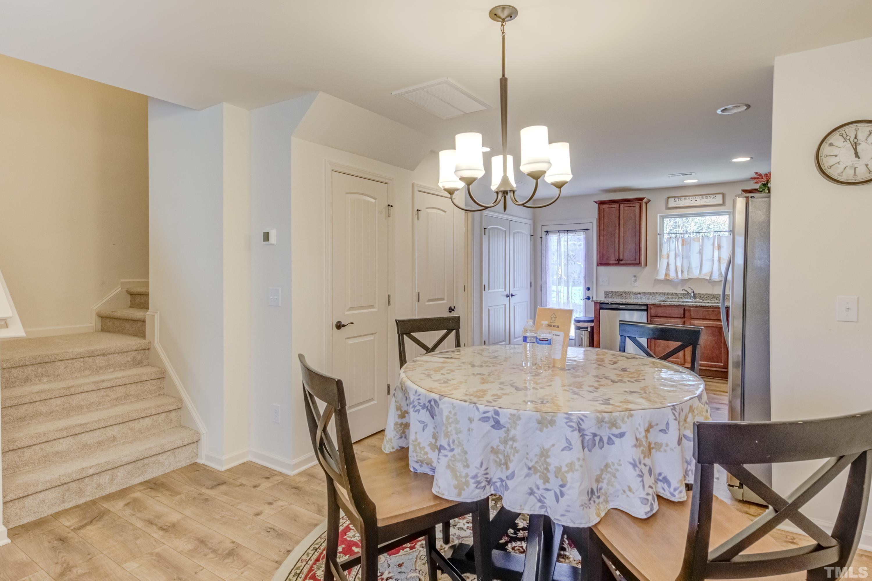 240 Spark Street Raleigh, NC 27606 - Photo 12 of 35 a view of a dining room with furniture and wooden floor
