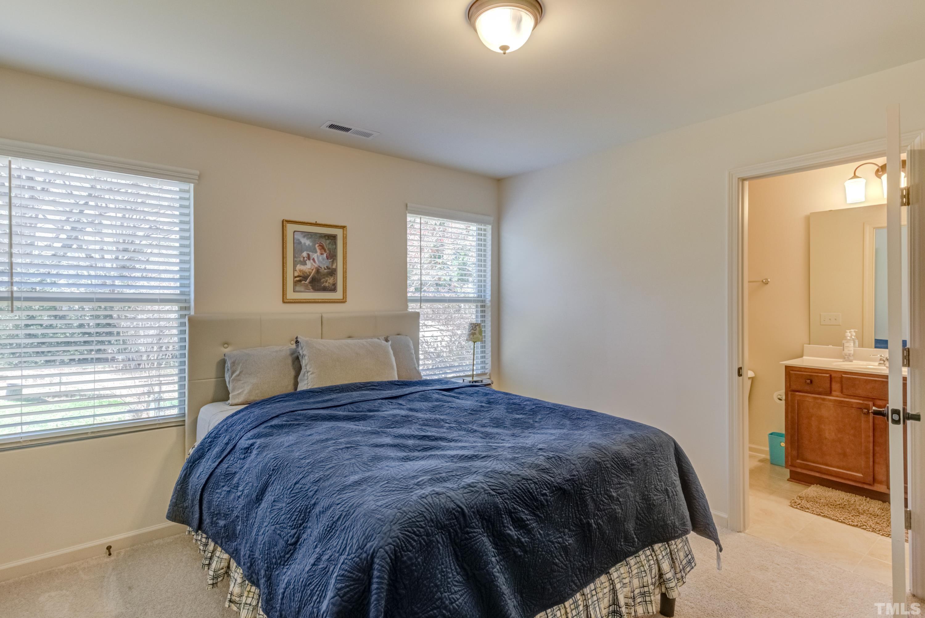 240 Spark Street Raleigh, NC 27606 - Photo 25 of 35 a bedroom with a bed and dresser