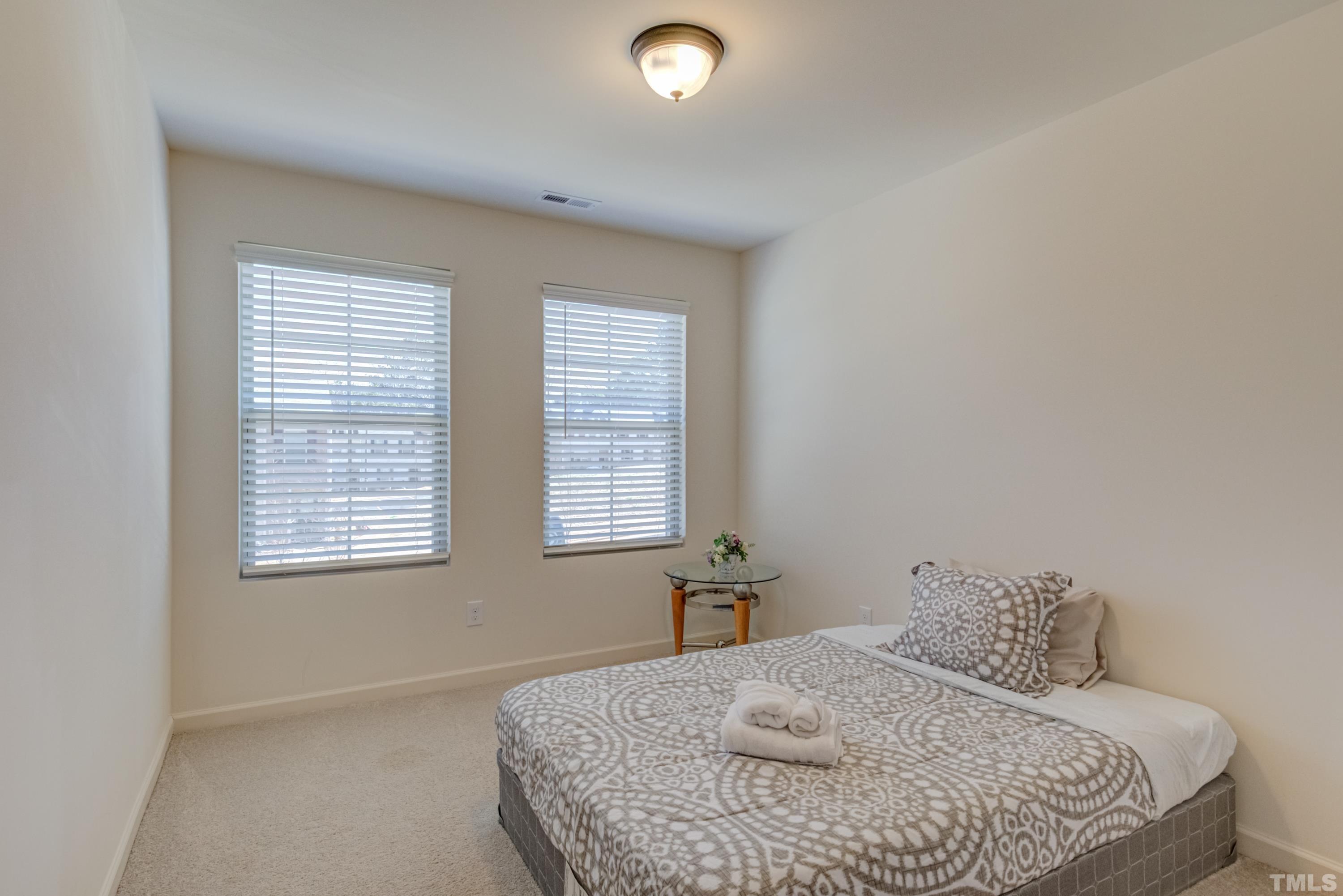 240 Spark Street Raleigh, NC 27606 - Photo 28 of 35 a bedroom with a bed and window
