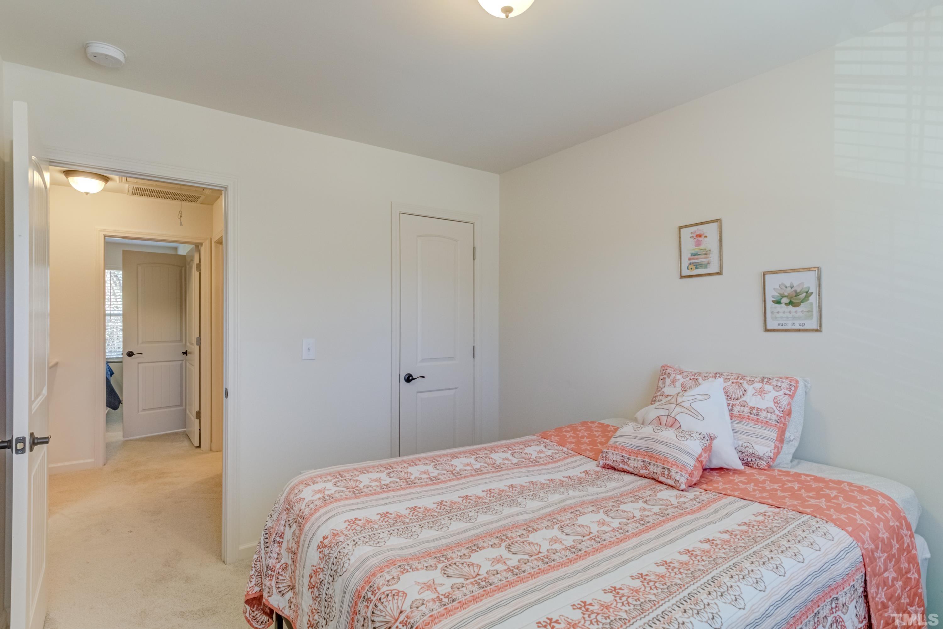 240 Spark Street Raleigh, NC 27606 - Photo 31 of 35 a bedroom with a bed and painting on the wall