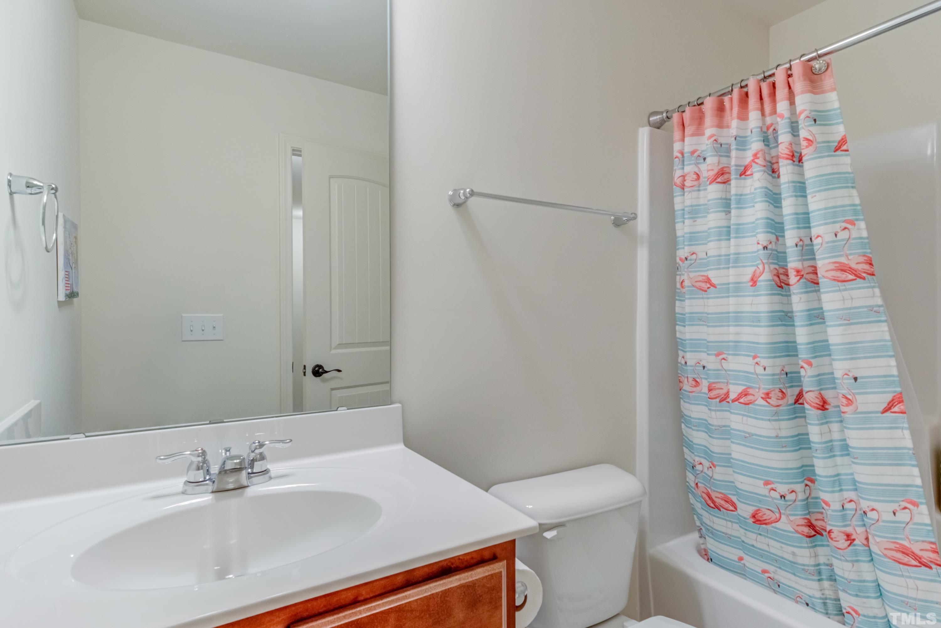 240 Spark Street Raleigh, NC 27606 - Photo 33 of 35 a bathroom with a sink toilet and shower