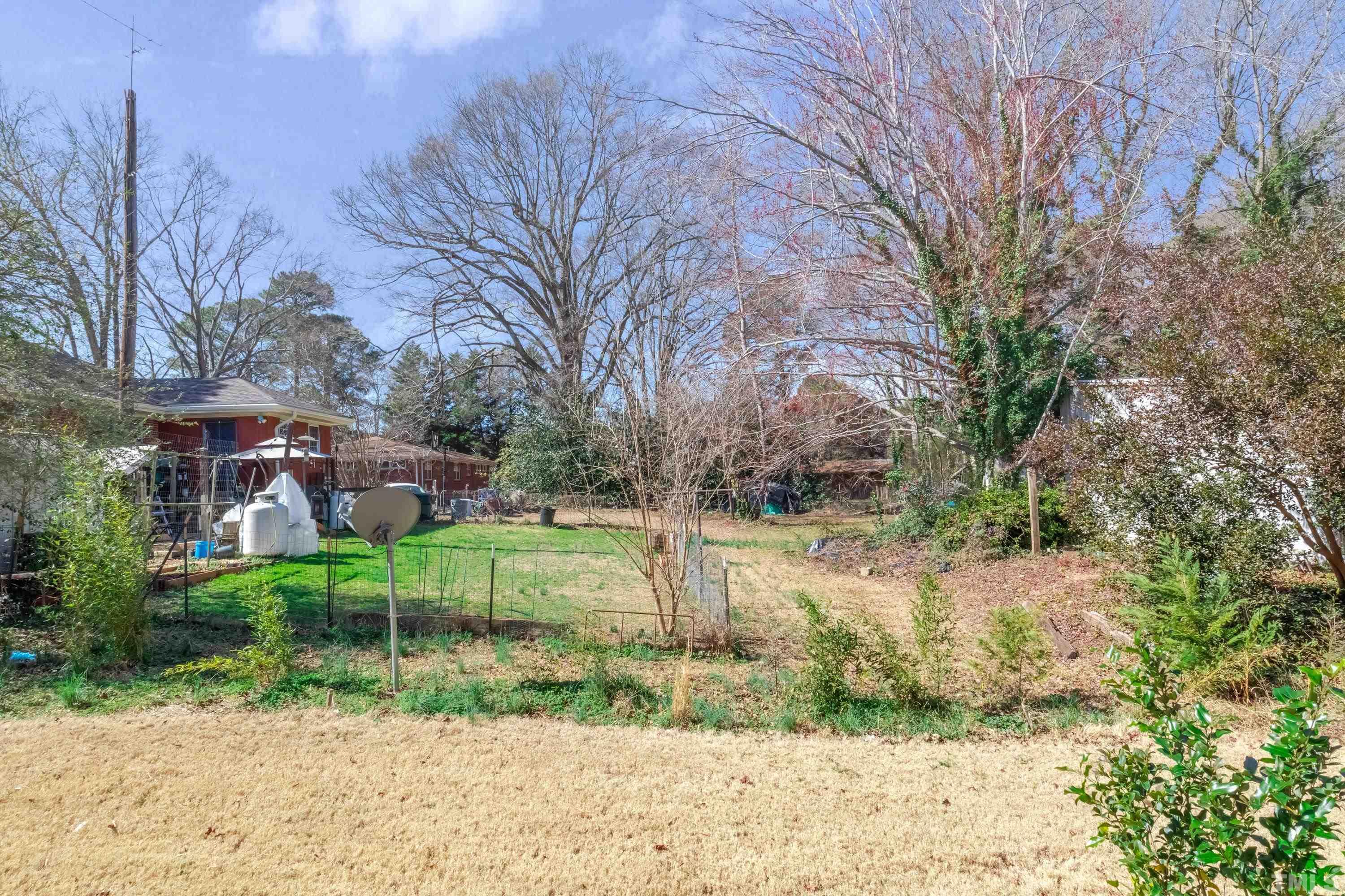240 Spark Street Raleigh, NC 27606 - Photo 35 of 35 a backyard of a house with garden and patio