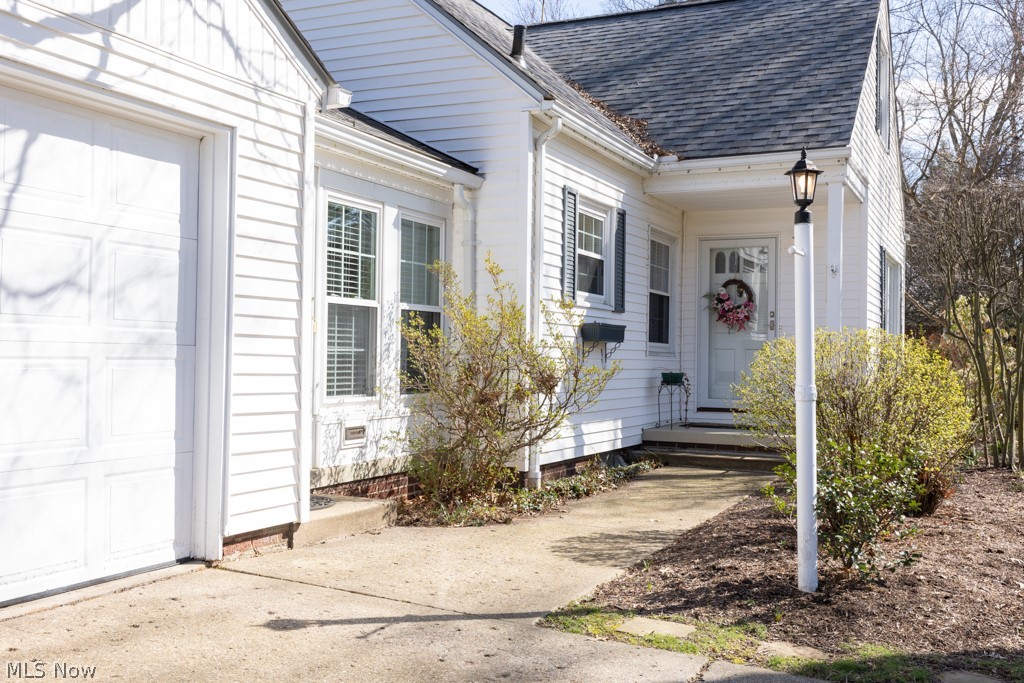175 Grandin Road Akron, OH 44313 - Photo 22 of 27 Doorway to property with a garage