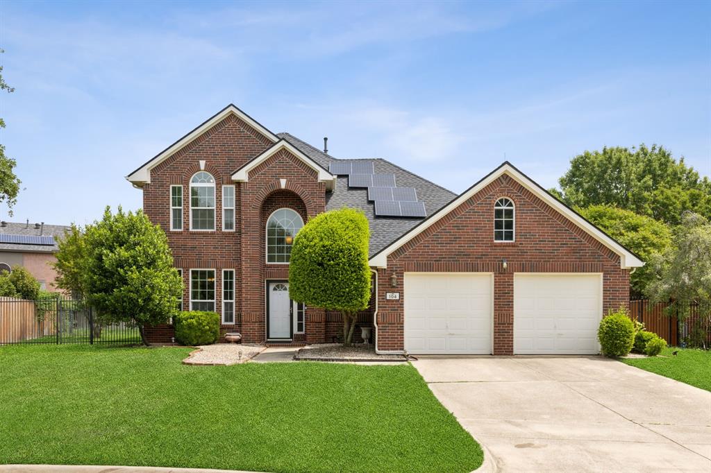104 Rolling Rock Drive Trophy Club, TX 76262 - Photo 1 of 1 front view of a house with a yard and potted plants