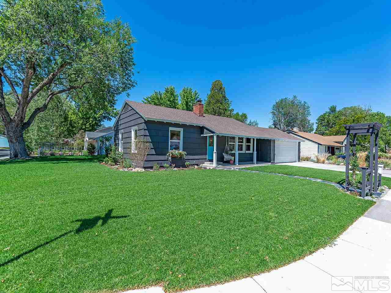1055 Primrose Street Reno, NV 89509 - Photo 1 of 26 a front view of a house with a yard