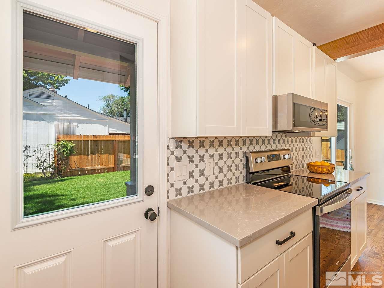 1055 Primrose Street Reno, NV 89509 - Photo 15 of 26 a kitchen with a stove and a sink