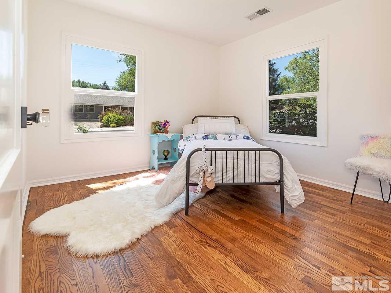 1055 Primrose Street Reno, NV 89509 - Photo 19 of 26 a bedroom with a bed and a window
