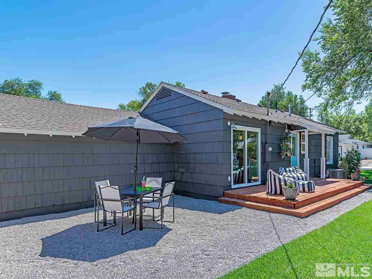 1055 Primrose Street Reno, NV 89509 - Photo 23 of 26 a backyard of a house with table and chairs