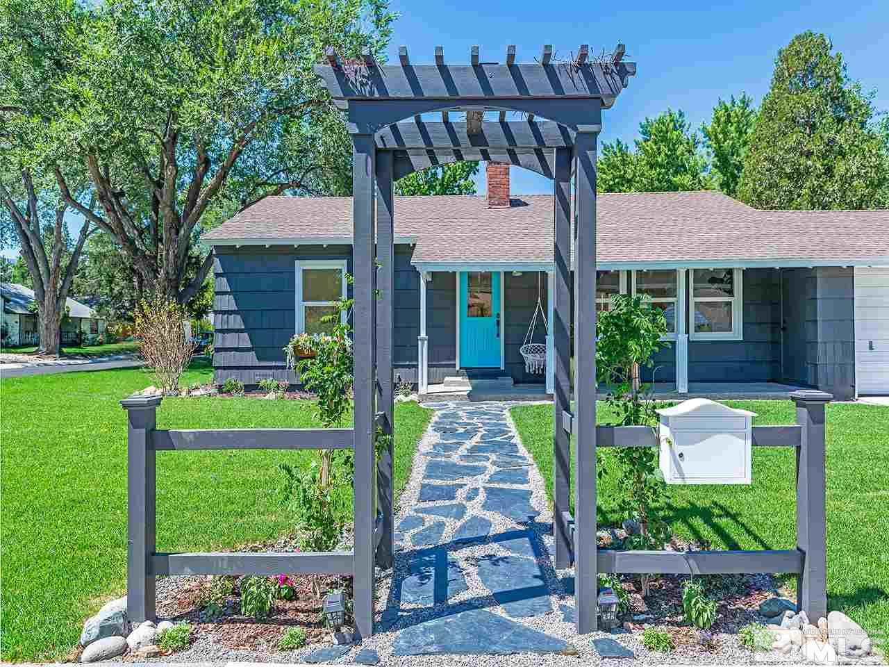 1055 Primrose Street Reno, NV 89509 - Photo 3 of 26 a front view of a house with garden