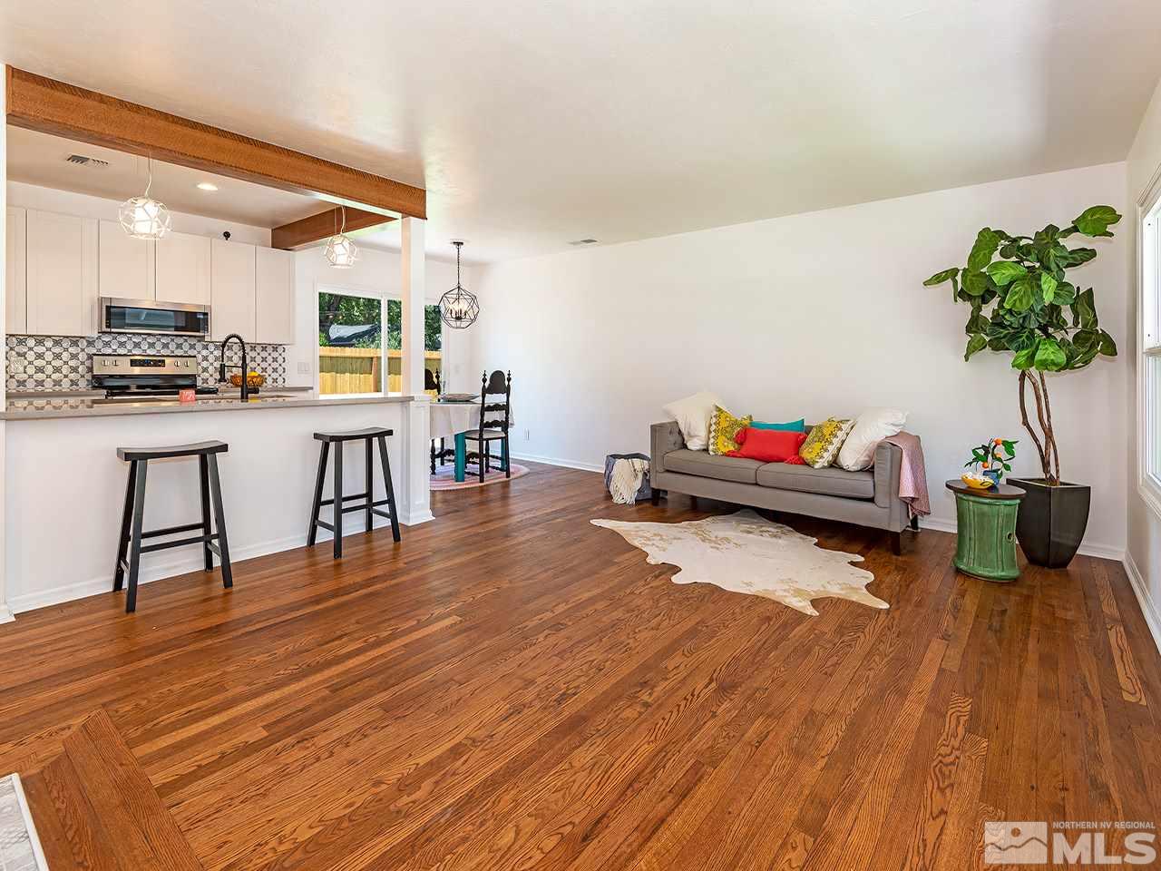 1055 Primrose Street Reno, NV 89509 - Photo 8 of 26 a living room with furniture and a wooden floor