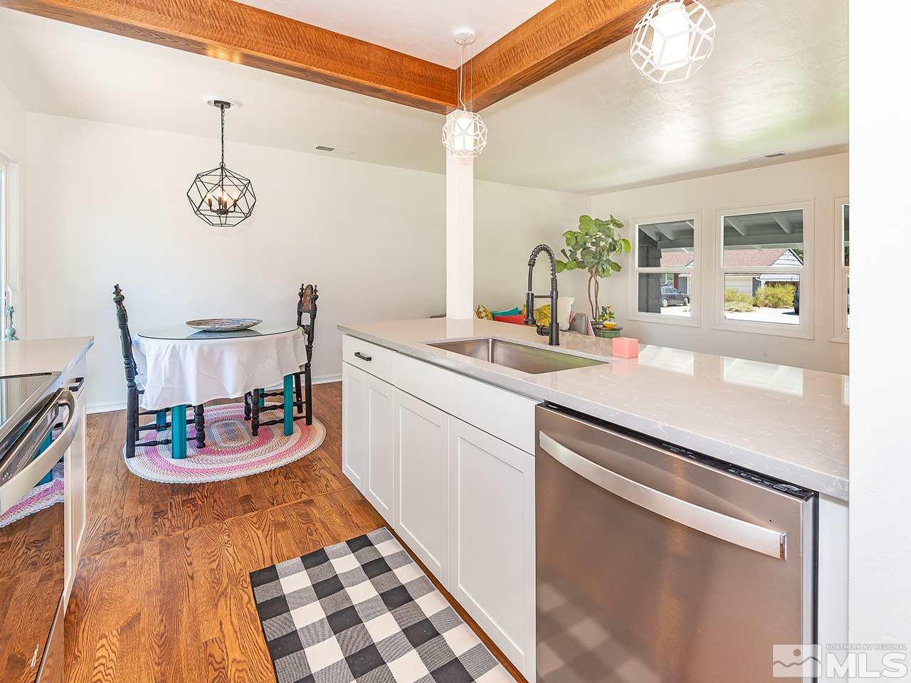 1055 Primrose Street Reno, NV 89509 - Photo 10 of 26 a kitchen with a sink and a stove top oven
