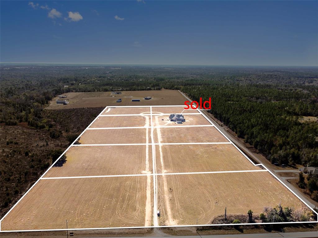11811 North Broad Street Brooksville, FL 34601 - Photo 2 of 16 a view of a tennis court with lots of space