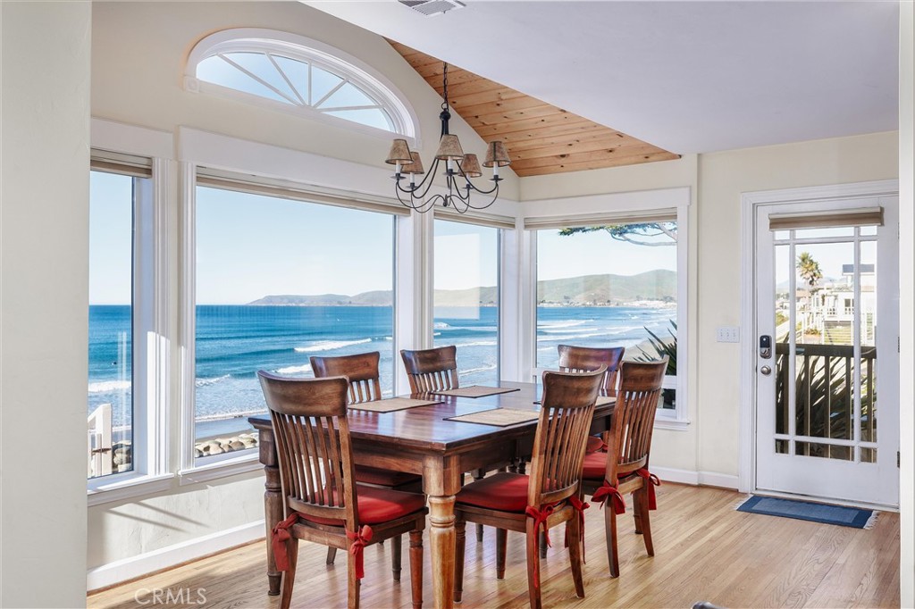 2850 Studio Drive Cayucos, CA 93430 - Photo 12 of 54 a view of a dining room with furniture window and wooden floor