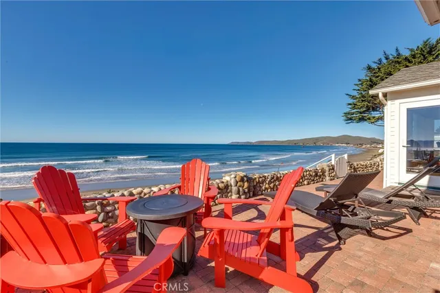 a view of a chairs in patio with swimming pool