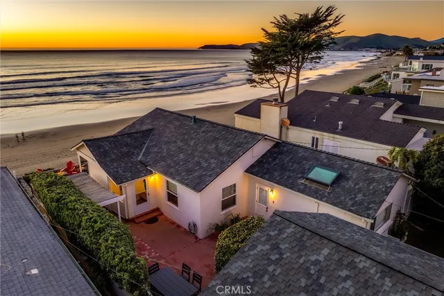 an aerial view of house with yard swimming pool and outdoor seating