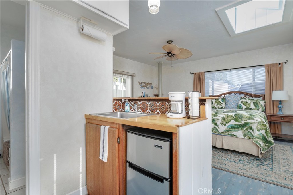 2850 Studio Drive Cayucos, CA 93430 - Photo 28 of 54 a view of kitchen with cabinets and fan