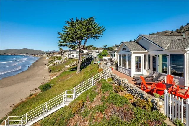 a view of a chairs and table in patio